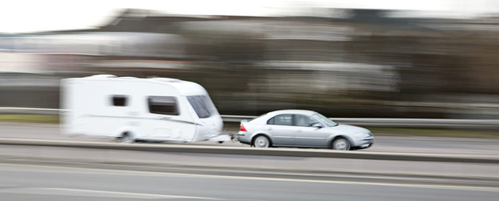 Car towing a caravan